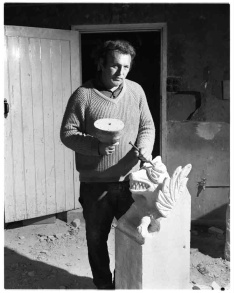 Frank Marshall carving a gargoyle