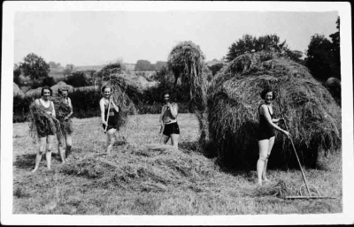 Ripon Land Girls in swimming costumes, hay making