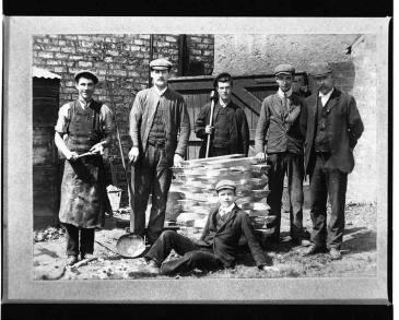 The Benson family pose with lead ingots