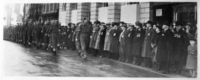 Troops march past the Town Hall